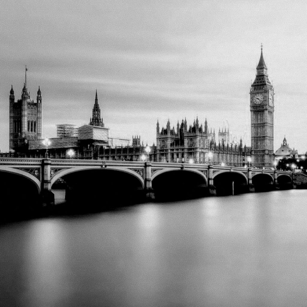 Black and white view of Westminster Bridge and Big Ben in London at dusk